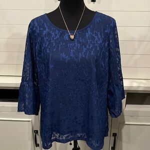 Beautiful navy and lace blouse with sheer sleeves. Top is lined